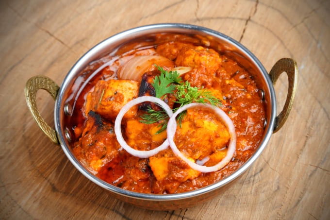 Indian Food or Indian Curry in a copper brass serving bowl.